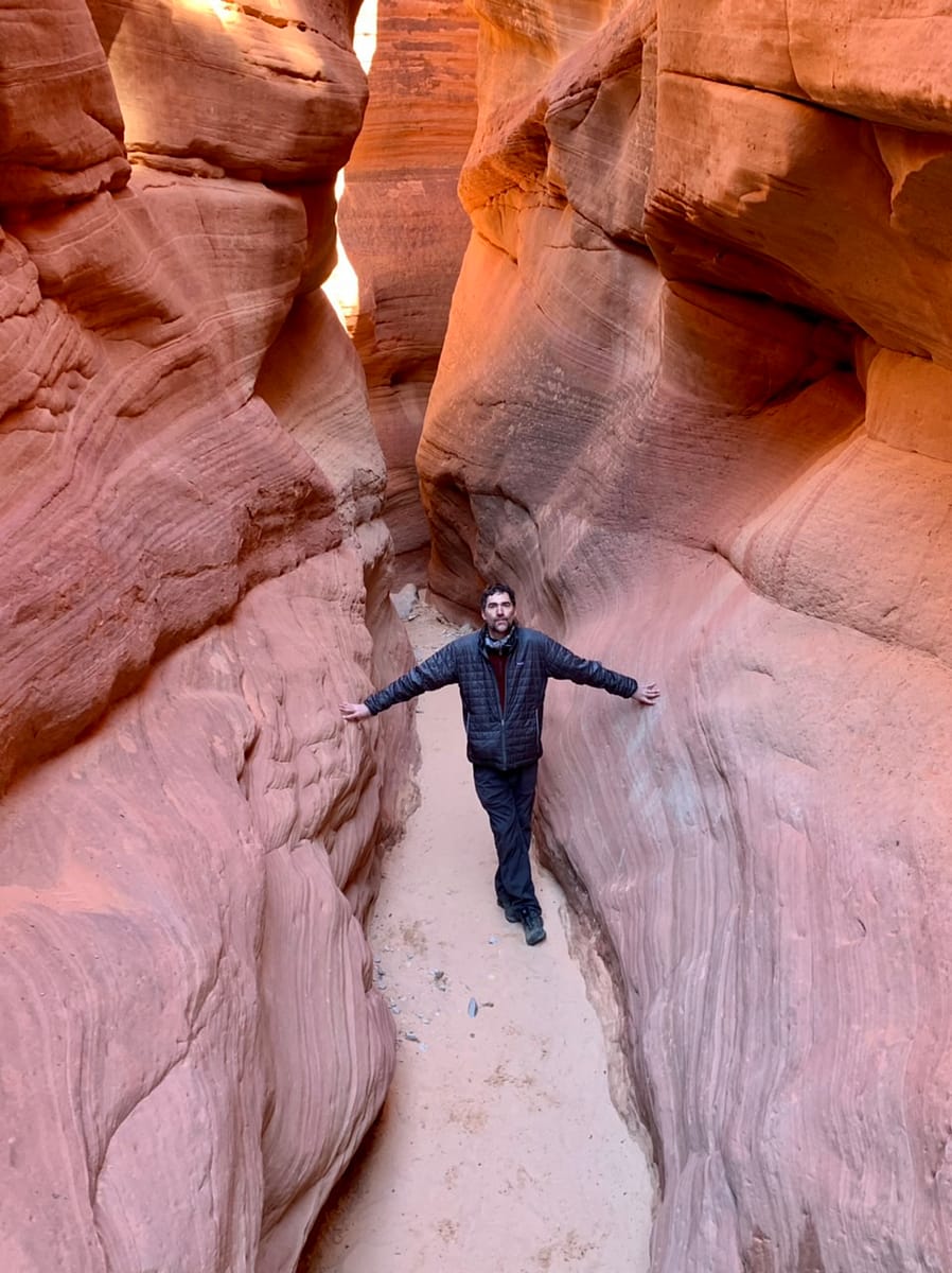 Easily touching sandstone walls in Peek-A-Boo Slot Canyon
