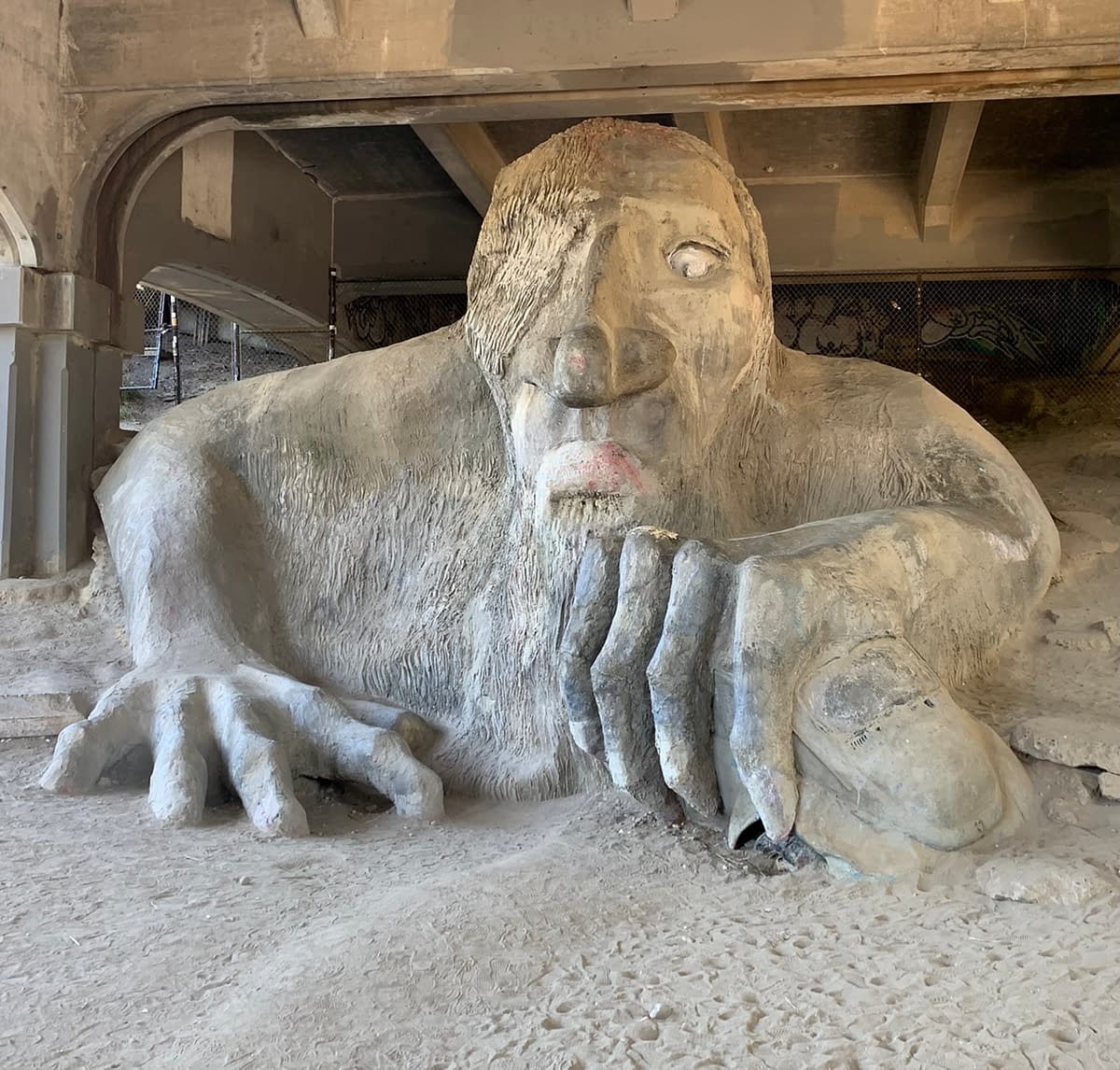 The Fremont Troll sitting underneath the north end of the Aurora Bridge in Seattle