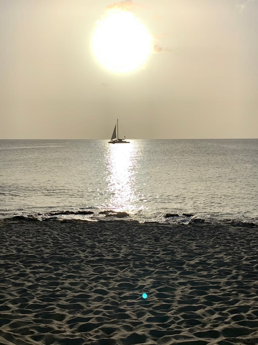 A ship passes through a Caribbean sunset in St Croix US Virgin Islands