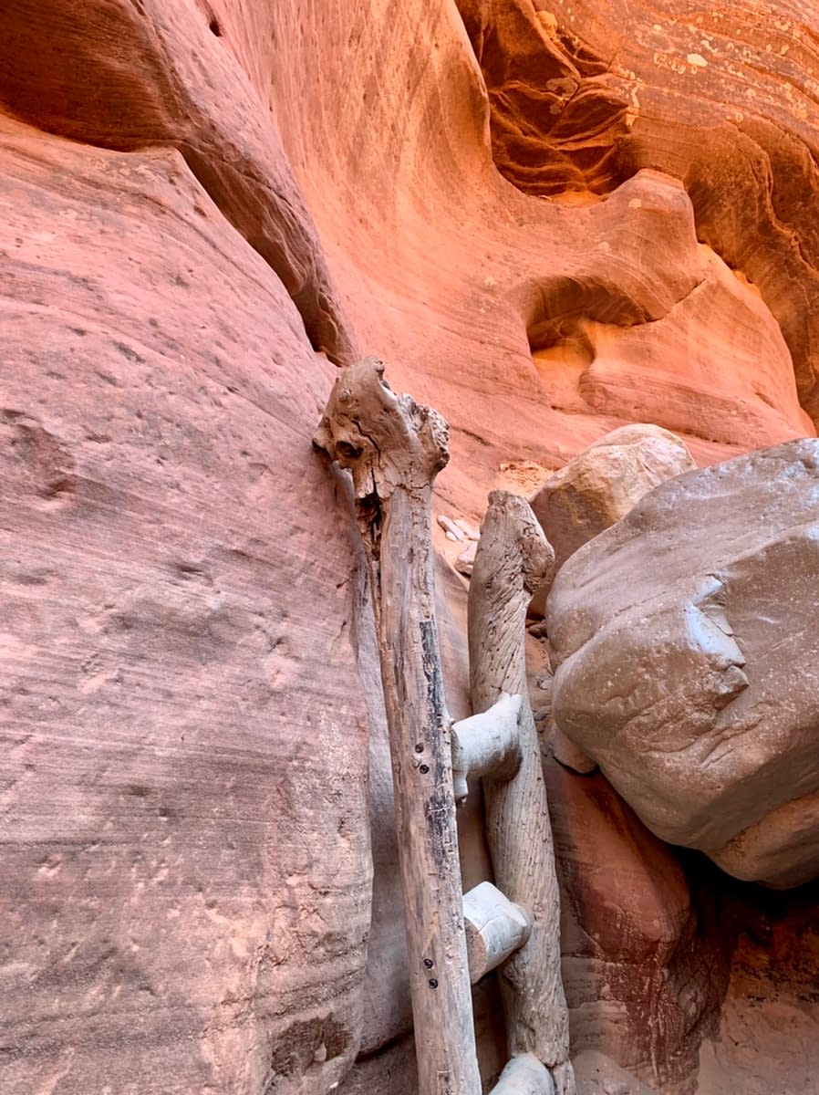 A ladder is placed to help hikers through Peek-A-Boo Slot Canyon