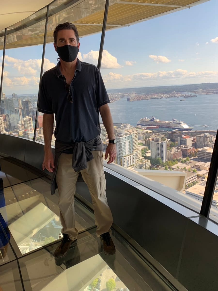 A scared Thorough Tripper standing on the see-through Loupe while visiting the Space Needle