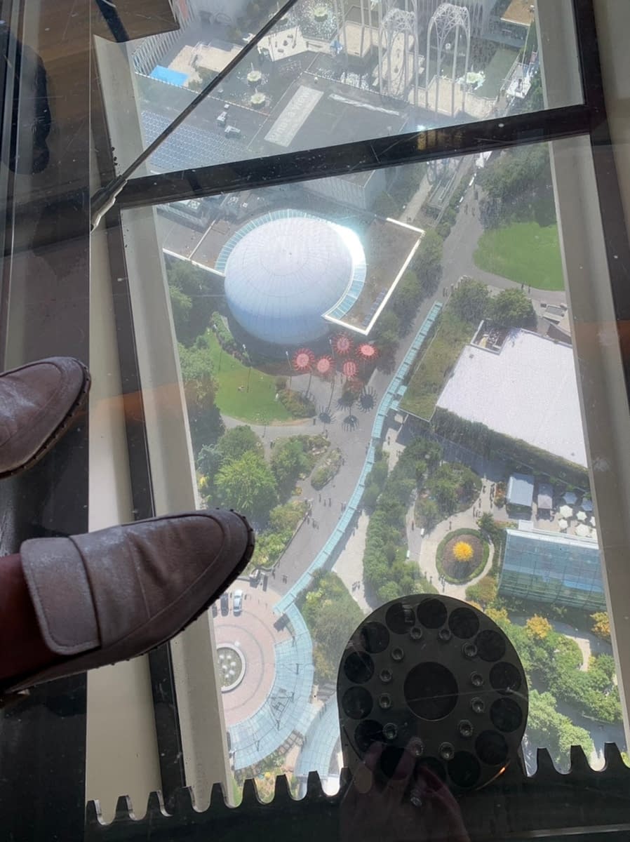 Looking down to Seattle Center from The Loupe while visiting the Space Needle