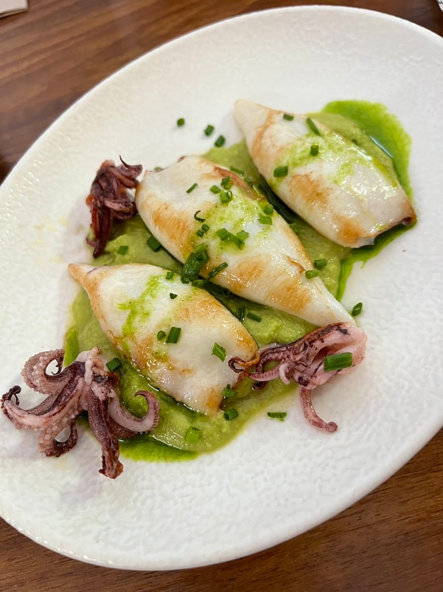 A tapa of grilled squid and pea hummus
