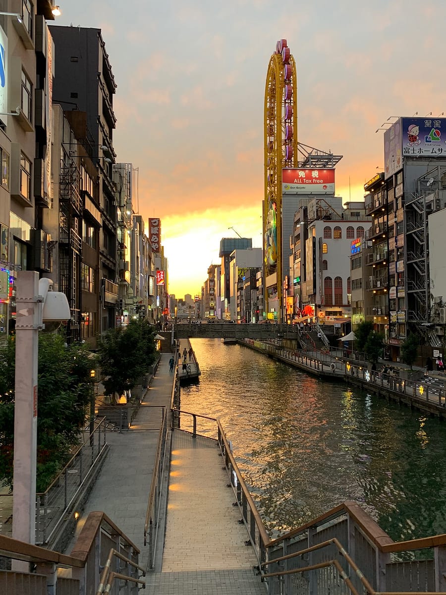 Along the Dontonbori canal in Osaka Japan at sunset. 