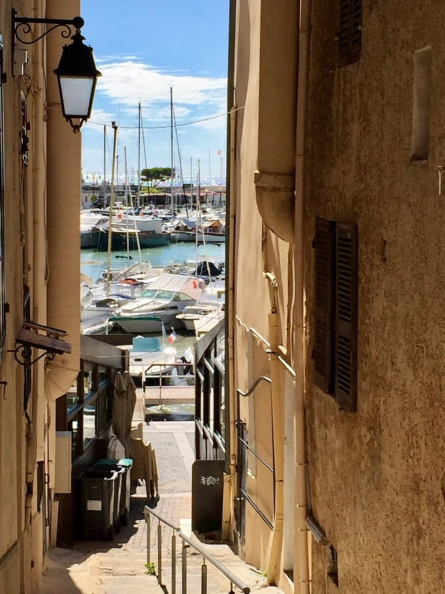 An alleyway in Cassis France looking out to the harbor