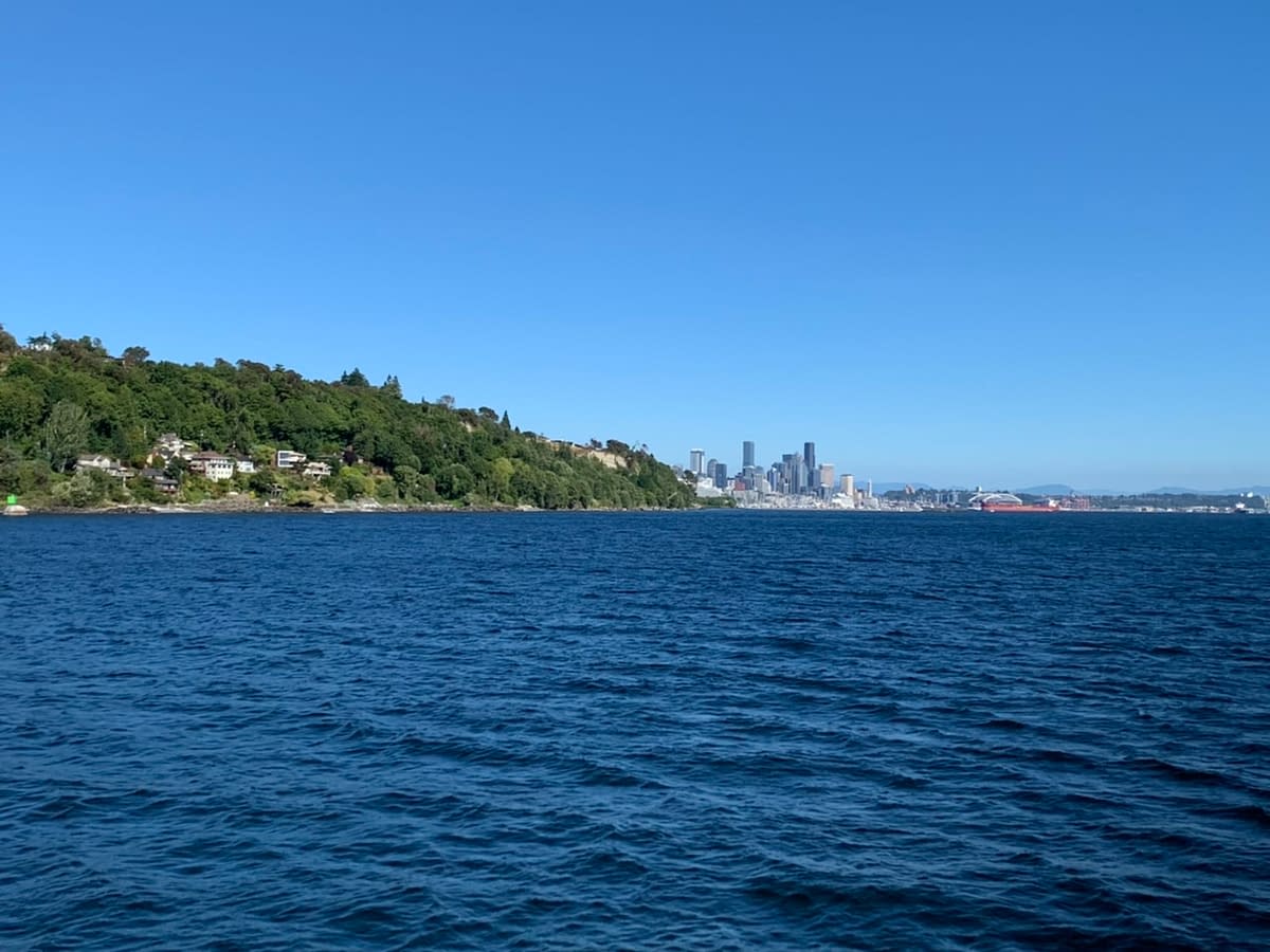 Downtown Seattle in the distance while boating southward along the Puget Sound with Argosy Cruises