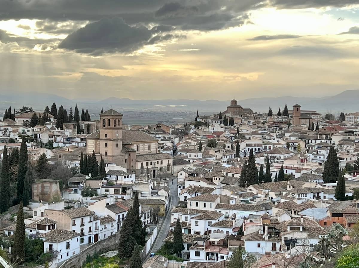 The sun sets over the Albaicin district in Granada Spain