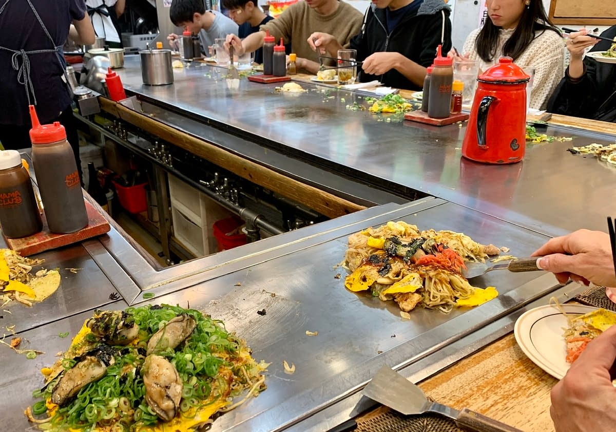 An experiential travel meal eating okonomiyaki at Ron in Hiroshima Japan