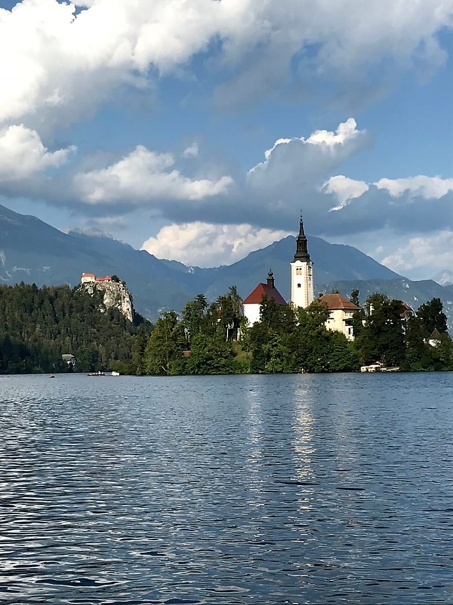 View of Bled Castle and island church across Lake Bled