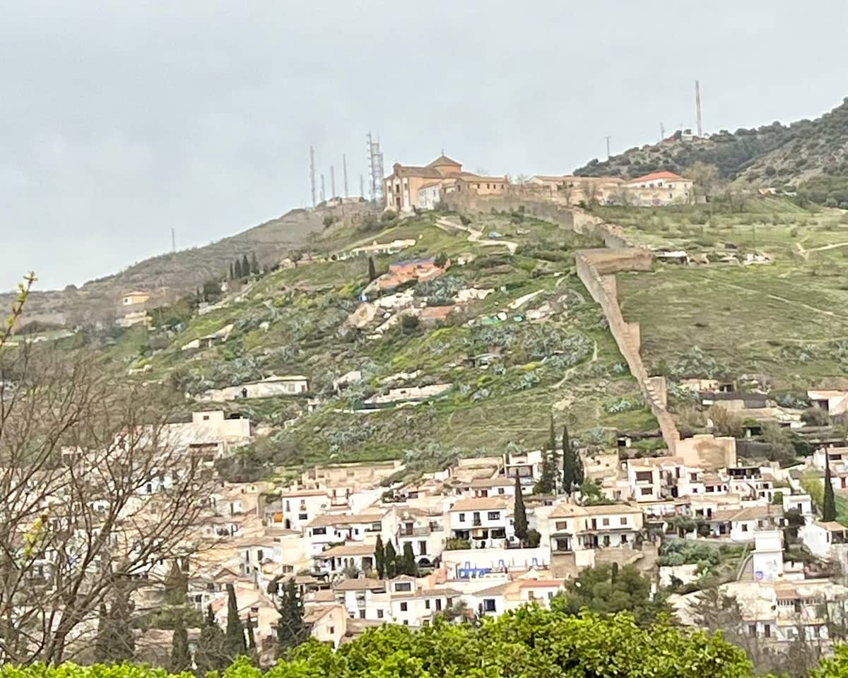 A view of Granada's ancient city wall, the Albaicin, and Ermita de San Miguel Alto