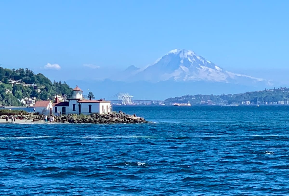 West Point Lighthouse and Mount Rainier as seen while touring the waterways around Seattle with Argosy Cruises