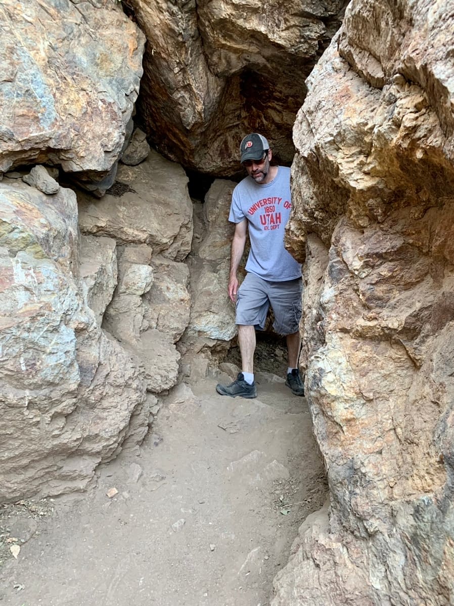 Walking through the rock tunnel along the Bonneville Shoreline Trail in Draper Utah