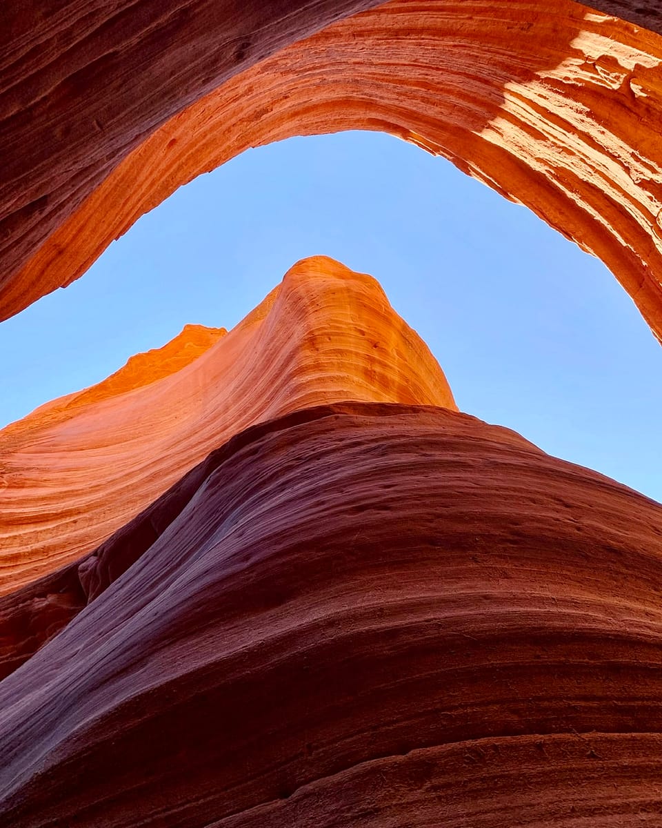 Looking up to a ribbon of sky from Peek-A-Boo Slot Canyon