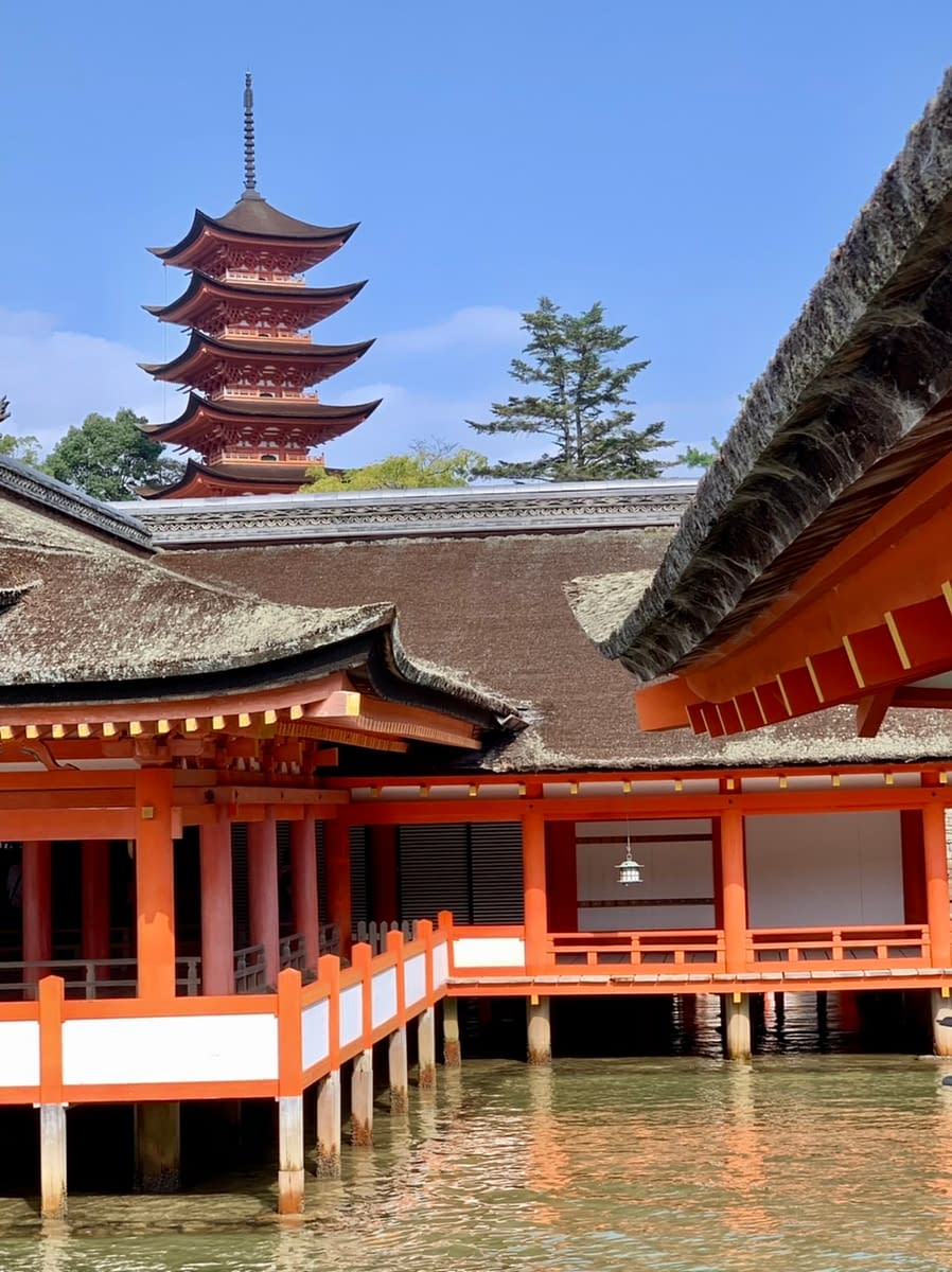 While walking through the Itsukushima Shrine with the 5-storied pagoda behind