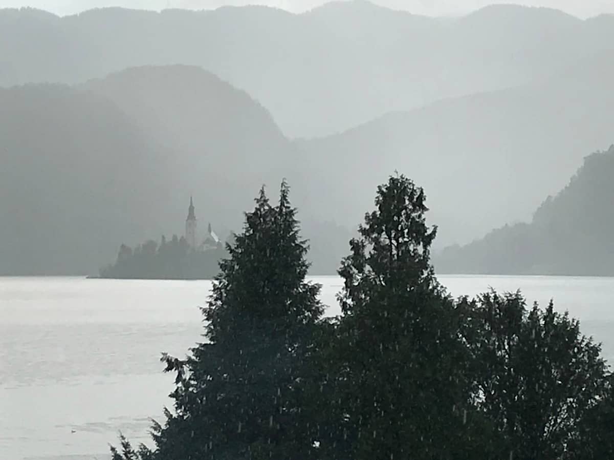 View across Lake Bled in the rain to the church on the island