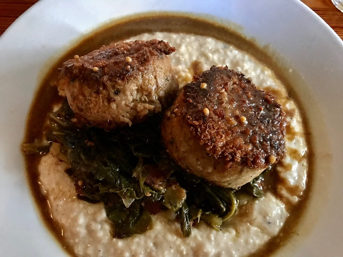 Fried Pork Shoulder, Grits, and Greens at Sylvain in the French Quarter for Thanksgiving in New Orleans