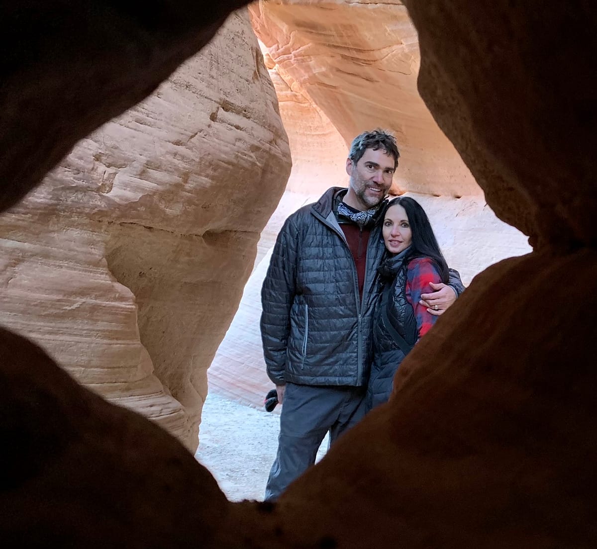 Looking through a sandstone window in Kanab Utah's Peek-A-Boo Slot Canyon