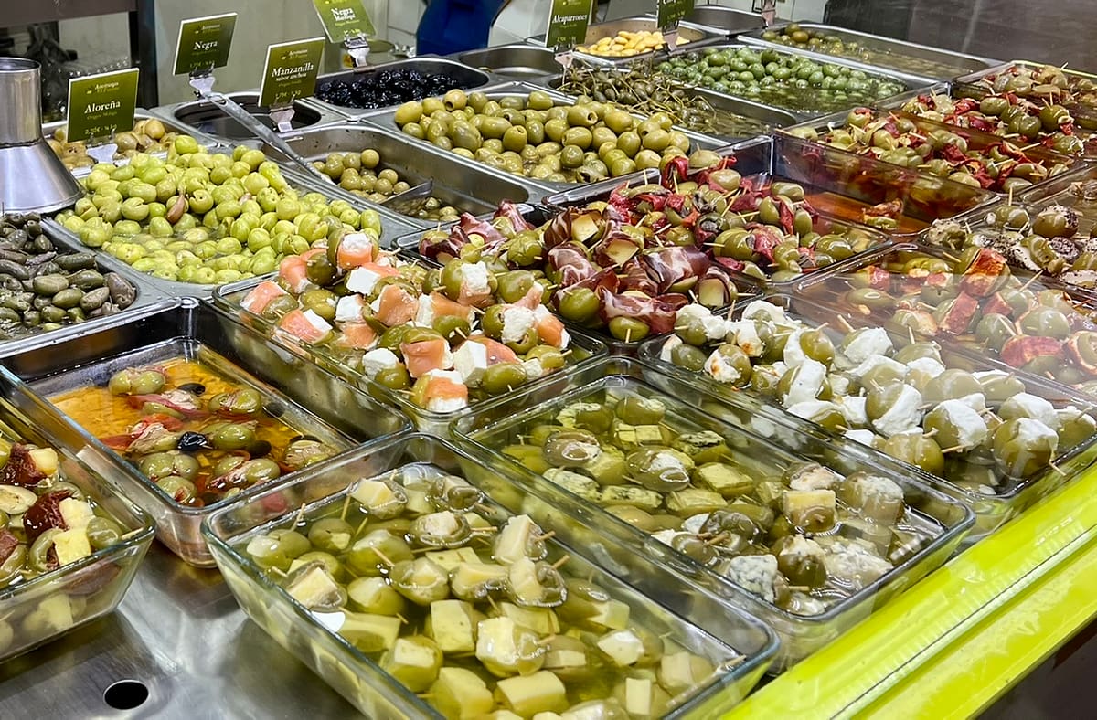 Olives lined up in Seville's Triana market