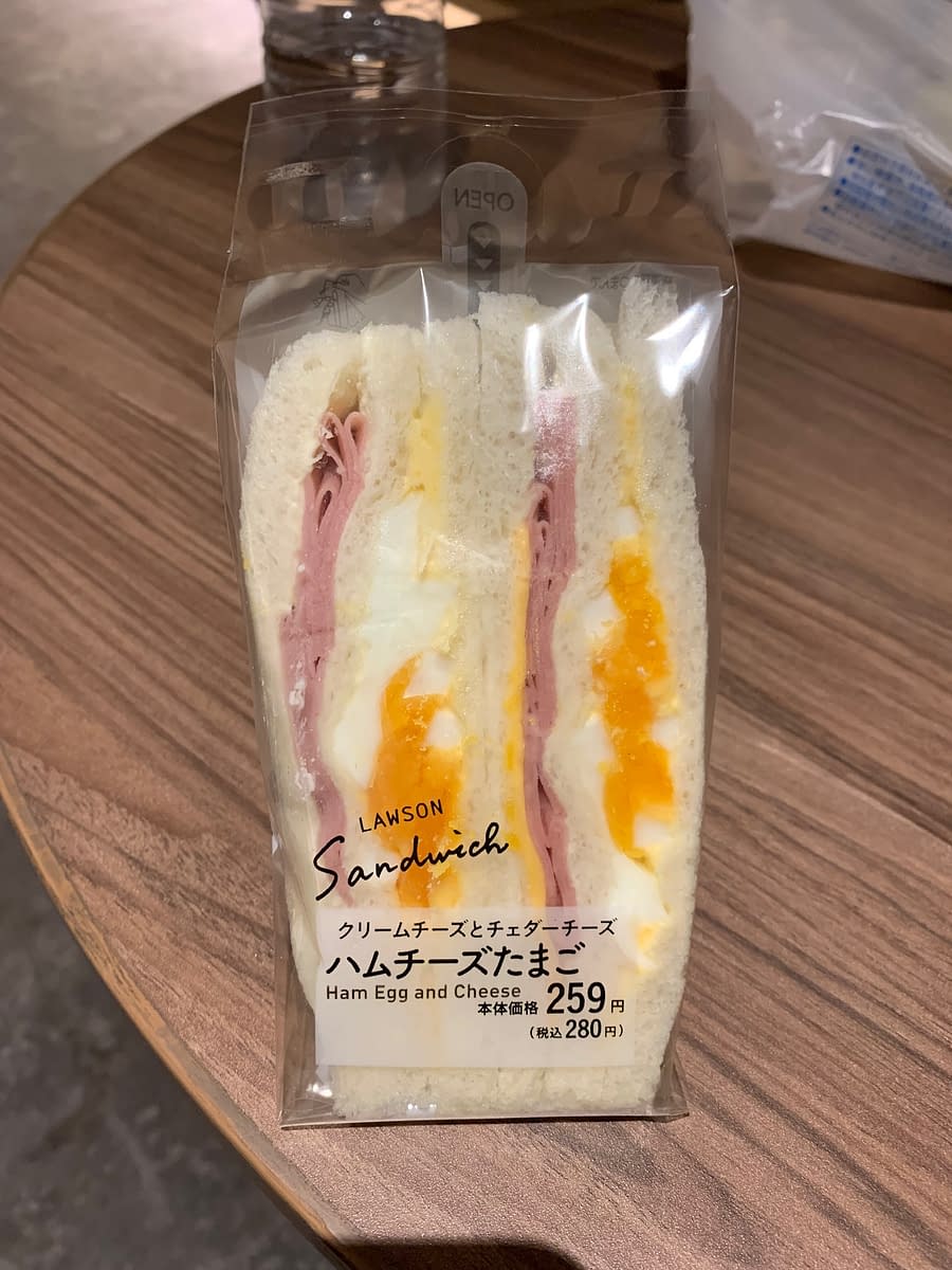 A Lawson ham, egg, and cheese sandwich.  A tasty grab and go options from one of Japan's great convenience store chains.
