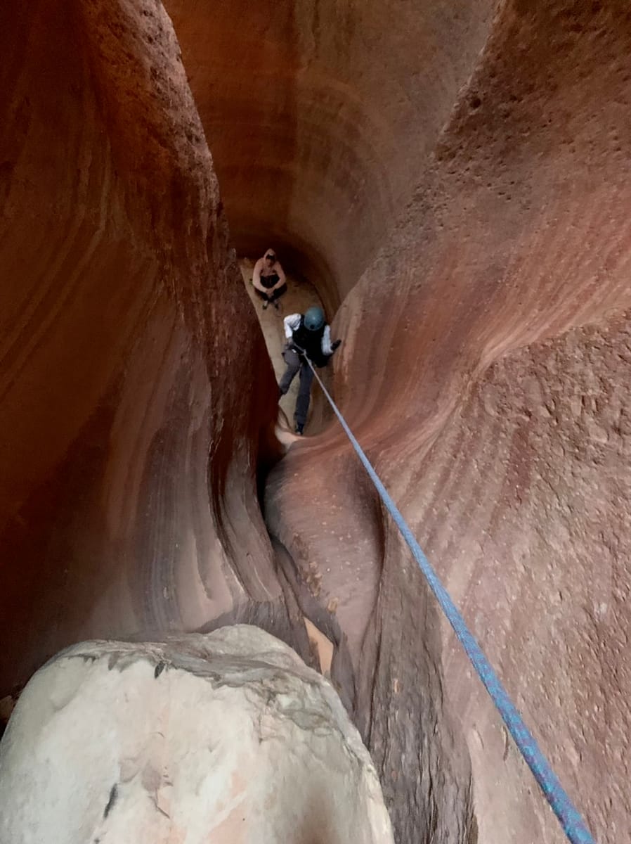 Near the bottom of a 65 foot rappel in a Utah slot canyon 